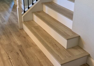 Folsom luxury vinyl plank steps with painted risers.