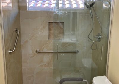 Tub and tile out-shower with grab bars in for older client in Folsom.